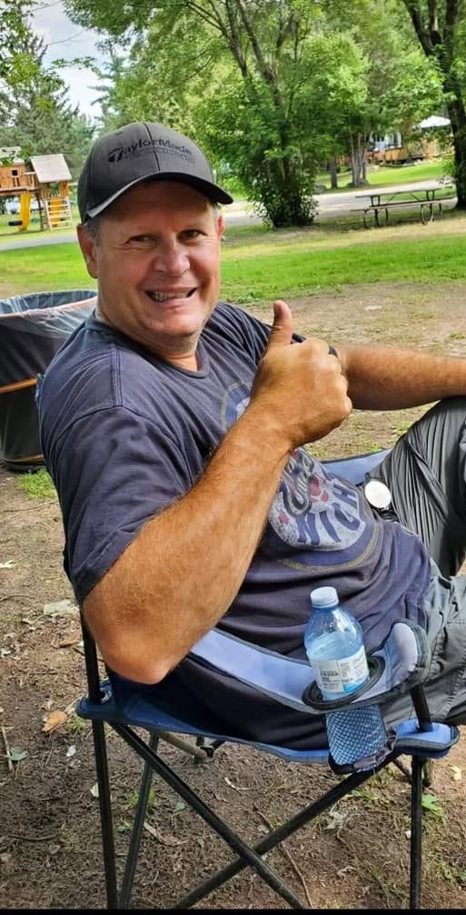 Denis Desjardins smiling outdoors