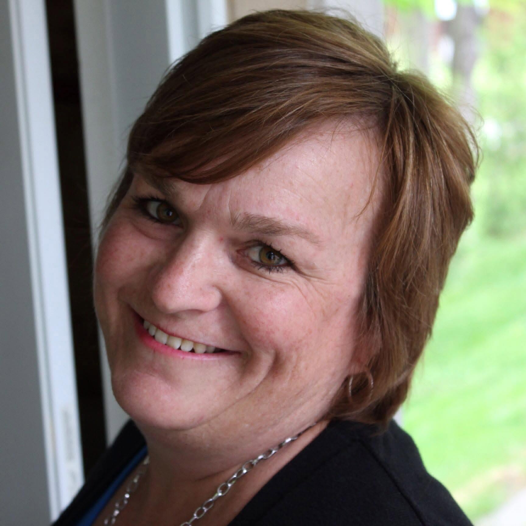 Portrait of Lynda smiling